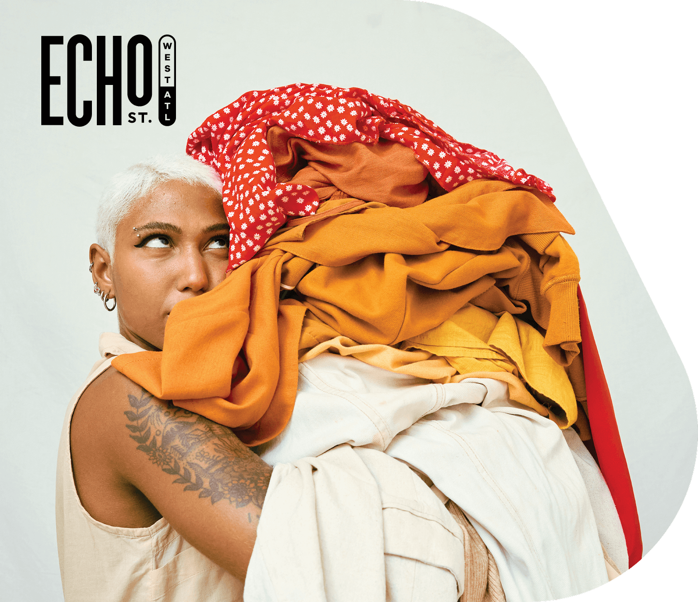 Echo St. West Atlanta logo over image of woman holding load of laundry
