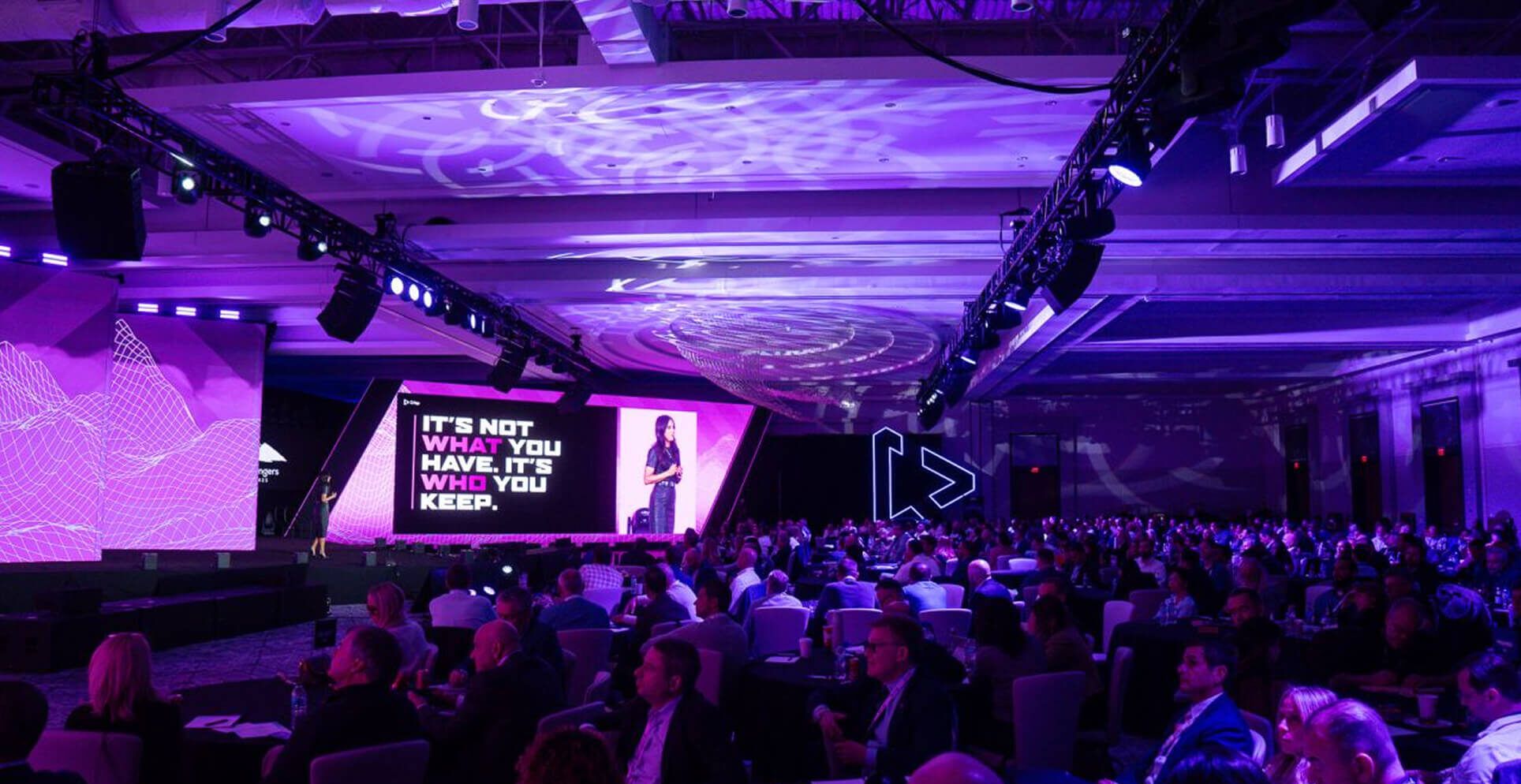 Wide shot of the Gam Changer Summit audience and stage